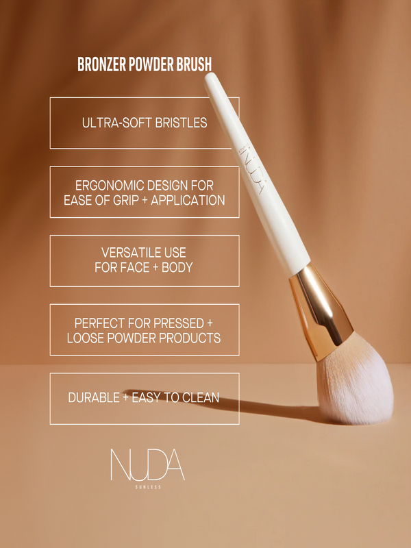 Bronzing Powder Brush | NUDA with ultra-soft bristles, ergonomic white handle, and rose gold ferrule, designed for versatile, durable application on face and body powder products.