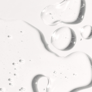 Clear gel texture with small bubbles representing the lightweight hydration of Hyaluronic Self Tanning Serum | NUDA for skincare and body care wellness.