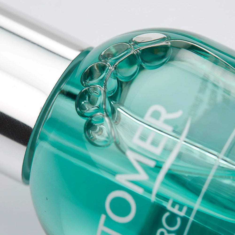Clear glass dropper bottle containing green moisturizing serum labeled Oligoforce Advanced Wrinkle & Dark Spot Correction Moisturizing Serum with Oligomer | Phytomer for skincare and anti-aging benefits.