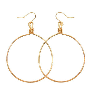 Pair of simple, elegant gold-tone hoop earrings with delicate wire wrapping at the top, showcasing Olivia Hoop Earrings | Purpose Jewelry.