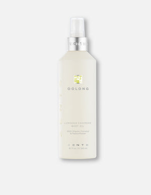 Bottle of Body Oil | Zents with a sleek, light-colored design featuring a pump dispenser, promoting skincare and body care wellness.