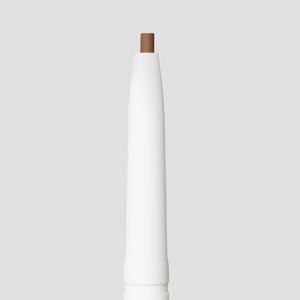 Close-up of the soft brown tip of the PureBrow Precision Pencil | Jane Iredale against a neutral background, highlighting its precise shape for detailed brow definition.