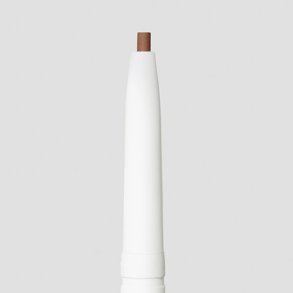 Close-up of the soft brown tip of the PureBrow Precision Pencil | Jane Iredale against a neutral background, highlighting its precise shape for detailed brow definition.