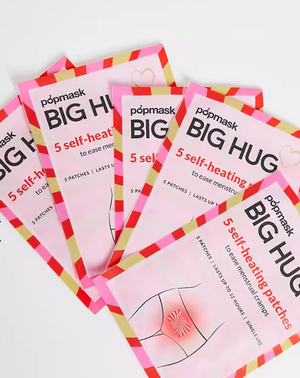 Popmask Big Hug - 5 Pack | Popmask showing pink and red packaging of self-heating patches designed to ease menstrual cramps with five patches per pack.