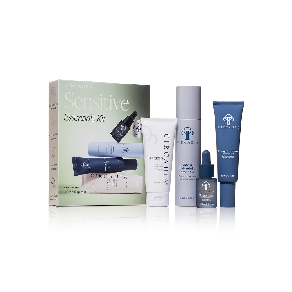 A collection of skincare products in white, blue, and lavender packaging alongside a box labeled Sensitive Essentials Kit, featuring the Sensitive Regimen Bundle | Circadia for gentle skincare.