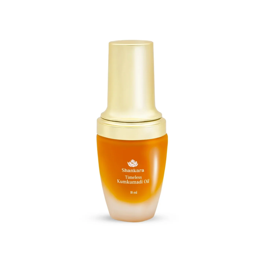 Bottle of Timeless Kumkumadi Oil | Shankara with golden cap and amber-colored glass, a luxury skincare product for glowing and radiant skin.