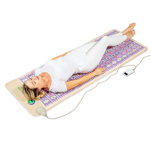 Woman lying relaxed on a TAJ-Mat™ Full 7224 Firm - Photon PEMF InfraMat Pro® | HealthyLine wellness device mat designed for body care and recovery.