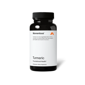 A black bottle of dietary supplement labeled Turmeric by Momentous, promoting joint health and muscle recovery with antioxidant properties.