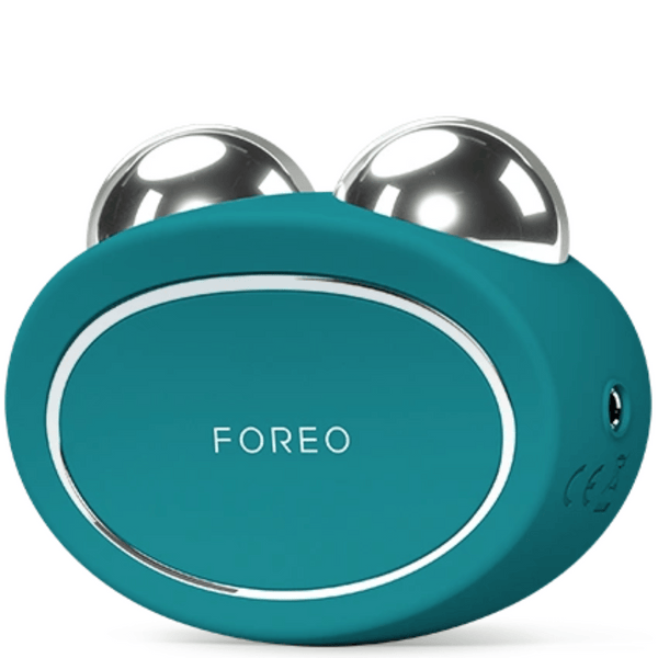 BEAR™ 2 | FOREO electric facial toning device with teal silicone body and two polished silver spheres for skincare and wellness care.