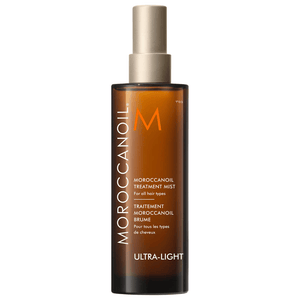 Moroccanoil Treatment Mist - Full Size | Moroccanoil ultra-light hair treatment spray in an amber bottle with a beige spray cap for all hair types.