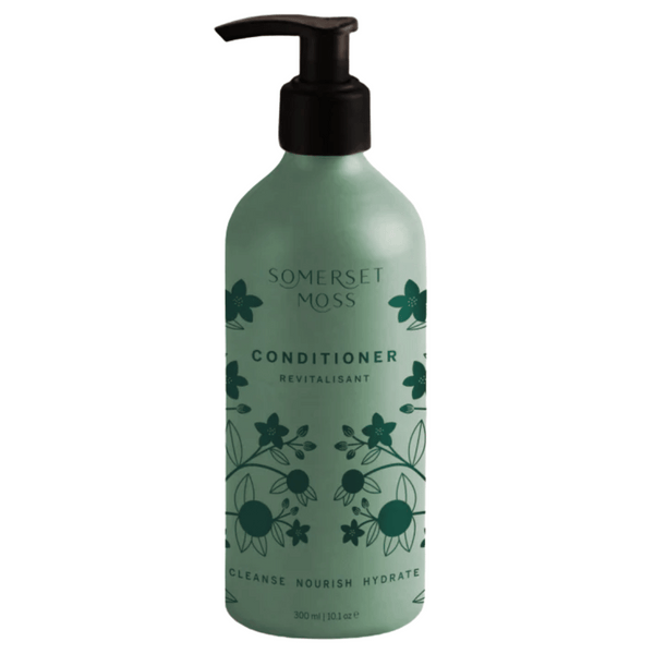 Bottle of Conditioner | Somerset Moss with green floral design, pump dispenser, and text highlighting cleanse, nourish, and hydrate benefits for hair care.