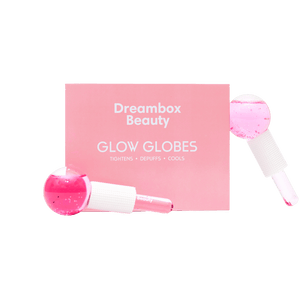 Glow Globes [Ice Roller for Face] | Dreambox Beauty features pink ice rollers designed for skincare to tighten, depuff, and cool the skin for a refreshed look.