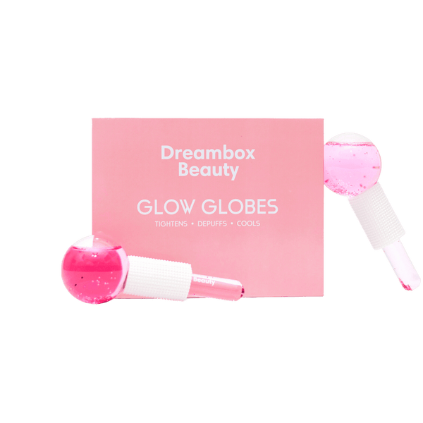 Glow Globes [Ice Roller for Face] | Dreambox Beauty features pink ice rollers designed for skincare to tighten, depuff, and cool the skin for a refreshed look.