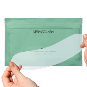 Hands holding a translucent silicone patch in front of a green Dermaclara package, showcasing the SiliconeFusion™ Neck Patch | Dermaclara designed for skincare and wrinkle reduction.