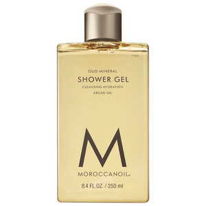Clear rectangular bottle of Shower Gel | Moroccanoil with golden liquid and minimalist black text highlighting argan oil and cleansing hydration.