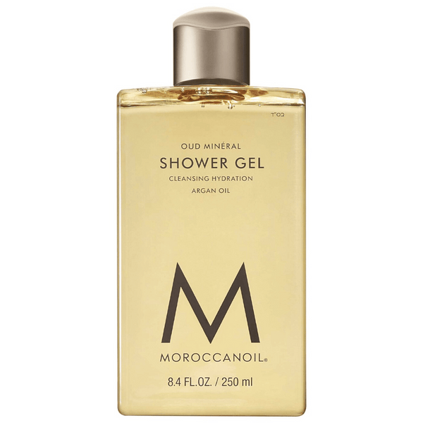 Clear rectangular bottle of Shower Gel | Moroccanoil with golden liquid and minimalist black text highlighting argan oil and cleansing hydration.