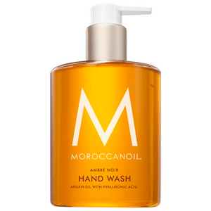 Hand Wash | Moroccanoil in a clear amber pump bottle featuring argan oil and hyaluronic acid for gentle skincare and body care, promoting hydration and wellness.