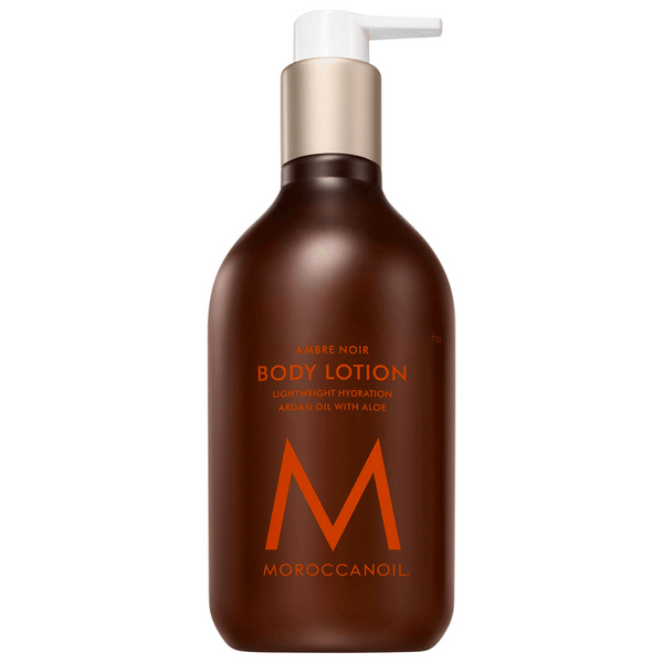 Bottle of Body Lotion | Moroccanoil in a dark amber pump container featuring lightweight hydration with argan oil and aloe for nourishing skincare.