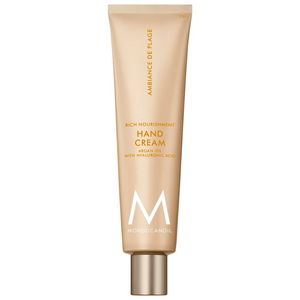 Tube of Hand Cream | Moroccanoil in beige packaging with gold and white text, highlighting argan oil and hyaluronic acid for rich nourishment in skincare.