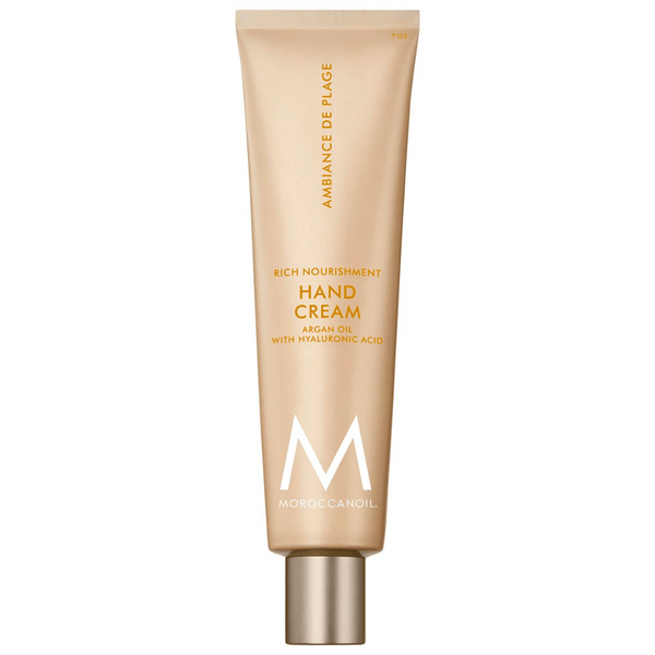 Tube of Hand Cream | Moroccanoil in beige packaging with gold and white text, highlighting argan oil and hyaluronic acid for rich nourishment in skincare.