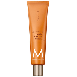 Tube of Hand Cream | Moroccanoil in orange packaging with silver cap, featuring nourishing argan oil and hyaluronic acid for skincare and body care.