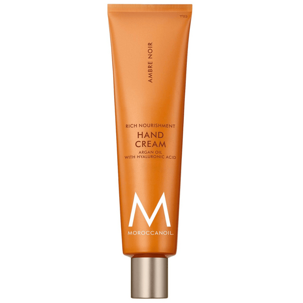 Tube of Hand Cream | Moroccanoil in orange packaging with silver cap, featuring nourishing argan oil and hyaluronic acid for skincare and body care.