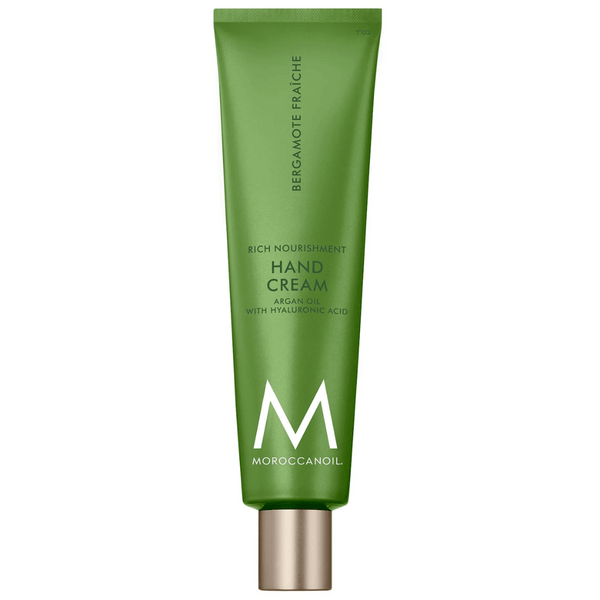 Green tube of Hand Cream | Moroccanoil featuring argan oil and hyaluronic acid for rich nourishment, designed for skincare and body care wellness.