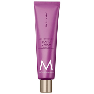 Purple tube of Hand Cream | Moroccanoil featuring argan oil and hyaluronic acid for rich nourishment in skincare and body care routines.