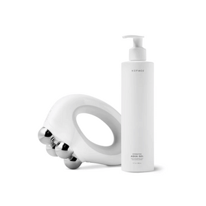 NuBODY® | NuFACE device with ergonomic design and silver massage rollers next to a white pump bottle of hydrating aqua gel for skincare and body care wellness.