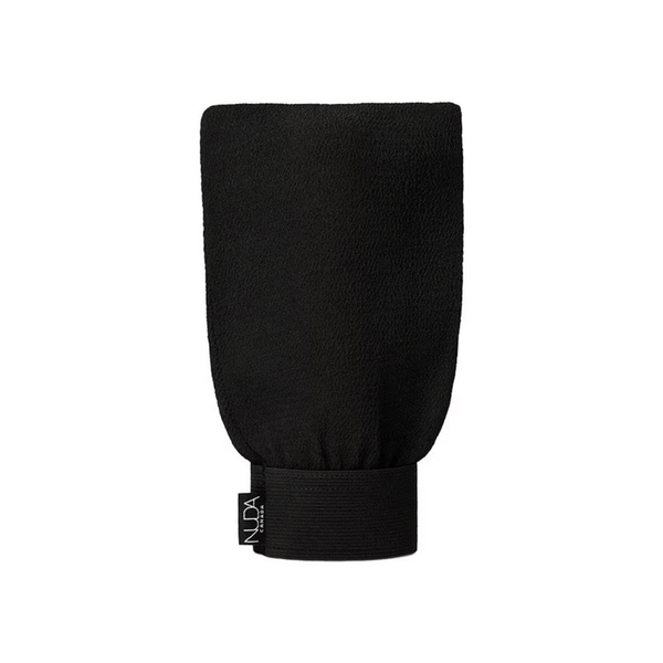 Black exfoliating mitt with elastic wristband and NUDA label, designed for effective skincare and body care exfoliation. Exfoliating Mitt | NUDA.