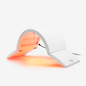 Elipsa | LightStim device emitting red light therapy for skincare and wellness, designed to provide rejuvenating treatment with a sleek, modern white arch shape.