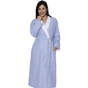 Woman wearing a comfortable striped blue robe with white lining and a waist tie, smiling confidently in the Seesucker Shimmer Lined Robe | Mansfield.