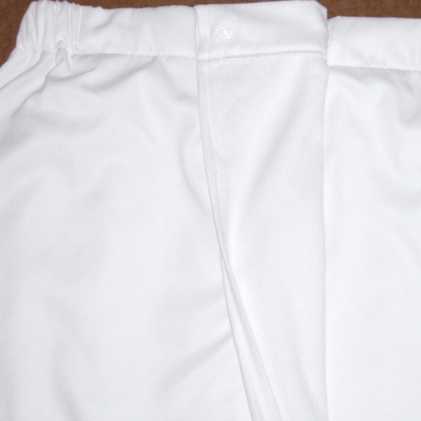 Close-up of white microfiber fabric with a soft shimmer lining, part of the Microfiber Shimmer Lined Spa Wrap | Mansfield designed for comfort during skincare and body care routines.
