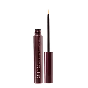 Open tube of Lash & Brow Enhancer Serum | Blinc with fine applicator brush, designed for precise skincare application to enhance lashes and brows.