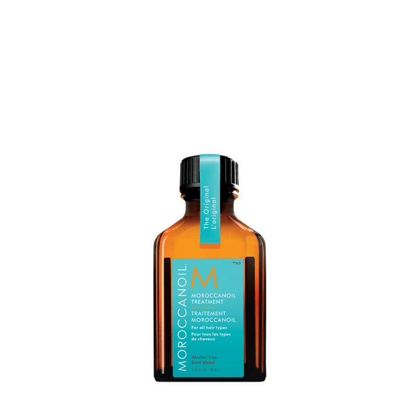 Moroccanoil Treatment | Moroccanoil in an amber glass bottle with a turquoise label designed for hair care, promoting smooth and healthy hair.