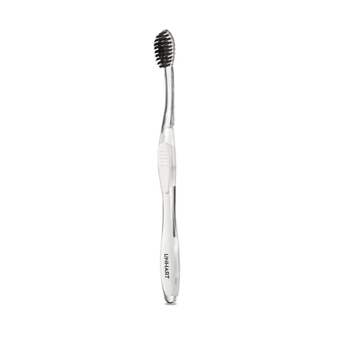 Nano-Silver Toothbrush | LINHART with sleek silver handle and black bristles designed for gentle, effective oral care promoting wellness and hygiene.
