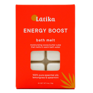 Packaging of Energy Boost – Bath Melt | Latika in vibrant orange with white moisturizing cocoa butter cubes visible through a window, highlighting lemongrass and spearmint essential oils for skincare and wellness.