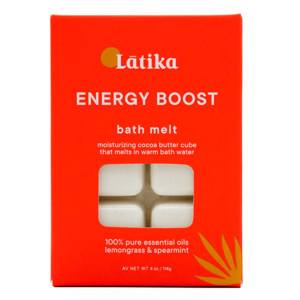 Packaging of Energy Boost – Bath Melt | Latika in vibrant orange with white moisturizing cocoa butter cubes visible through a window, highlighting lemongrass and spearmint essential oils for skincare and wellness.