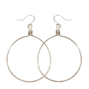 Minimalist silver hoop earrings with hammered texture and fishhook closures, showcasing elegant simplicity in the Olivia Hoop Earrings | Purpose Jewelry design.