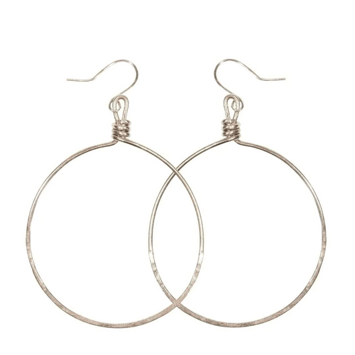 Minimalist silver hoop earrings with hammered texture and fishhook closures, showcasing elegant simplicity in the Olivia Hoop Earrings | Purpose Jewelry design.