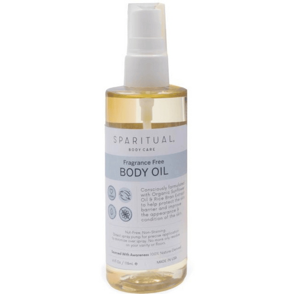 Clear bottle of Fragrance Free Body Oil | Sparitual with a white pump top, designed for gentle skincare and body care with organic sunflower oil and rice bran extract.
