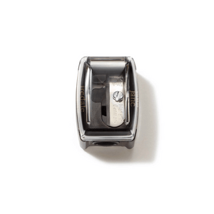 Compact pencil sharpener with a clear cover showing the blade inside, designed for precise sharpening, Pencil Sharpener | Jane Iredale.