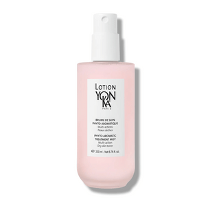 Bottle of Lotion YON-KA PS | YON-KA with pink liquid and white spray cap, designed for skincare and body care targeting dry skin with multi-action treatment.