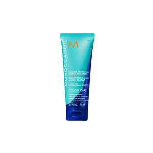 Tube of Blonde Perfecting Purple Shampoo | Moroccanoil in blue and turquoise packaging for color care, designed to nourish and maintain blonde hair.