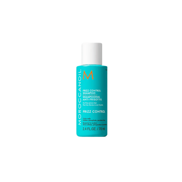Bottle of Frizz Control Shampoo | Moroccanoil in turquoise packaging with white cap, designed for color-safe hair care and frizz control.