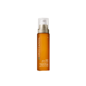 Night Body Serum | Moroccanoil in a sleek amber bottle with a pump dispenser, designed for skincare and body care to nourish and firm the skin overnight.