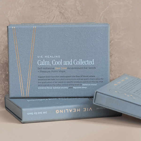 Packaging of Calm Cool Collected - 24K Gold Ear Seed | Vie Healing showing self-adhesive acupressure ear seeds and pressure point maps designed to support brain function, mood balance, focus, anxiety relief, and sleep regulation.