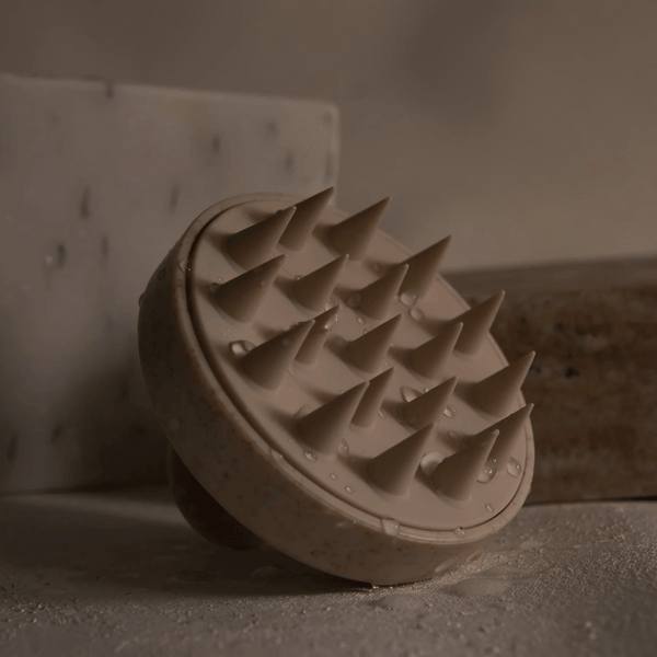 Restorative Scalp Massager | Vie Healing with soft massage spikes designed for scalp stimulation, promoting relaxation and wellness in a spa-like setting.
