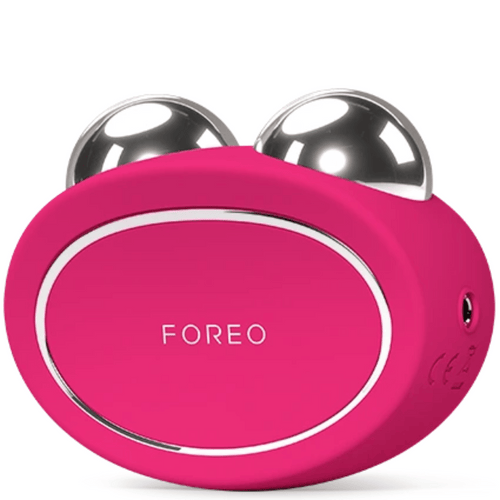 BEAR™ 2 | FOREO in bright pink with two polished metal spheres designed for facial skincare and muscle toning as a wellness device.