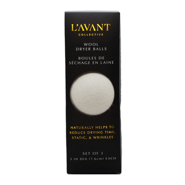 Black rectangular packaging showing a single white wool dryer ball through a window, labeled Wool Dryer Balls | L'AVANT Collective, promoting natural reduction of drying time, static, and wrinkles.